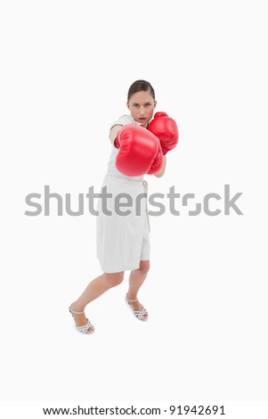 stock-photo-portrait-of-a-businesswoman-punching-someone-against-a-white-background-91942691.jpg