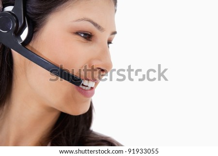 Side view of angry call center agent against a white background