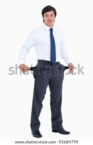 Tradesman showing his empty pockets against a white background