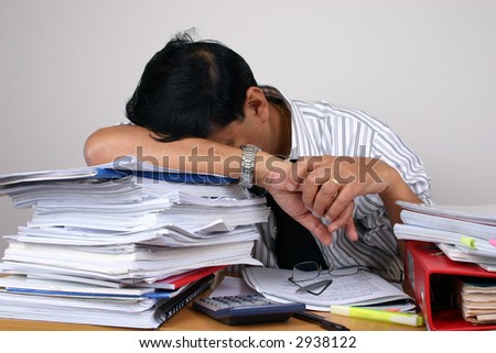 Indian business man working at his desk (Series)