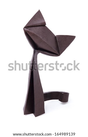 Origami paper black cat sitting on a white background Origami paper black cat sitting on a white background