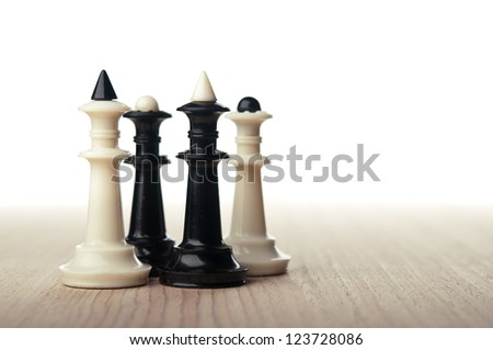 chess kings and queens on table