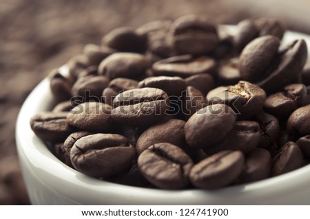 coffee mug with roasted beans background
