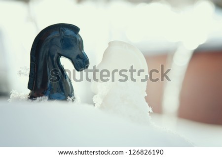 winter chess pieces knight on snow