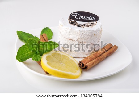 Tasty cake with mint and lemon on white background