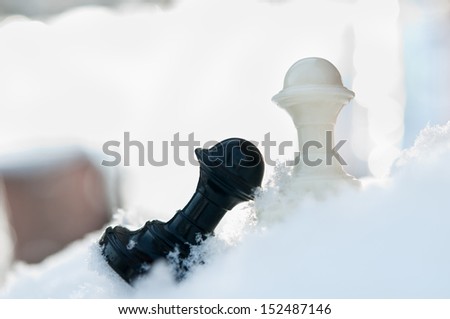 winter chess pieces pawn on snow