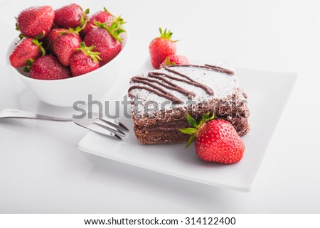 chocolate cake with strawberries fruit on white background