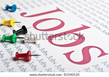 thumbtacks stack and a sheet of paper with text on job search
