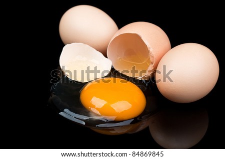 broken egg isolated on a black background
