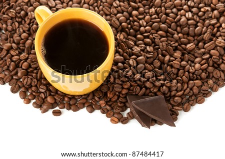 yellow cup of coffee and roasted beans isolated on a white background
