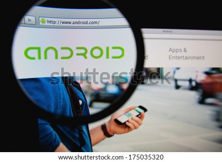 LISBON PORTUGAL FEBRUARY 5 2014 Photo of Android homepage on a monitor screen through a magnifying glass LISBON PORTUGAL FEBRUARY 5 2014 Photo of Android homepage on a monitor screen through a magnifying glass