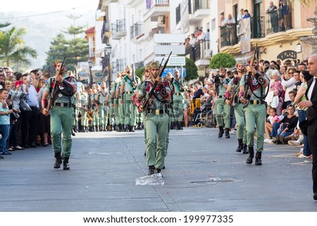 MALAGA, SPAIN - APRIL 18: Unidentified spanish legionnaires marching during an Easter parade on April 18, 2014 in Alhaurin de la Torre, Malaga, Spain.