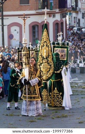 MALAGA, SPAIN - APRIL 18: Unidentified worshipers during the Holy Week parade celebration in Alhaurin de la Torre streets on April 18, 2014 in Malaga, Spain.
