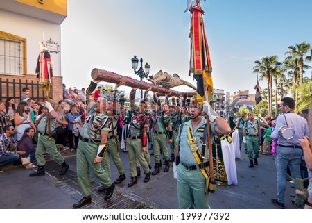 MALAGA, SPAIN - APRIL 18: Unidentified spanish legionnaires march with Mena Christ during an Easter parade on April 18, 2014 in Alhaurin de la Torre, Malaga, Spain.