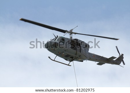 MALAGA, SPAIN - MAY 28: Agusta Bell helicopter flies over Malagueta Beach simulating a medical evacuation during the Spanish Armed Forces Day on May 28, 2011 in Malaga, Spain.
