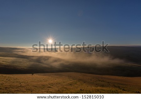 Sun rise above the mist