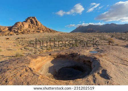 a Big round hole in the rock