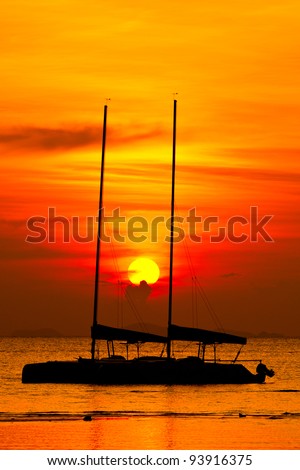 catamaran boat silhouette at sunset