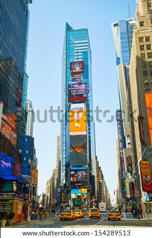 New York City - May 12: Times Square On May 12, 2013 In New York. Iconified As &Quot;The Crossroads Of The World&Quot; It\'S The Brightly Illuminated Hub Of The Broadway Theater District.