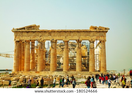 ATHENS - FEBRUARY 22: Parthenon at Acropolis with tourists on February 22, 2014 in Athens, Greece. The Parthenon is a temple on the Athenian Acropolis, Greece, dedicated to the maiden goddess Athena.