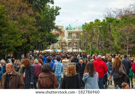 ATHENS - FEBRUARY 23: Crowded street on February 23, 2014 in Athens, Greece. It\'s a flea market neighborhood in the old town of Athens, and is one of the principal shopping districts in Athens.