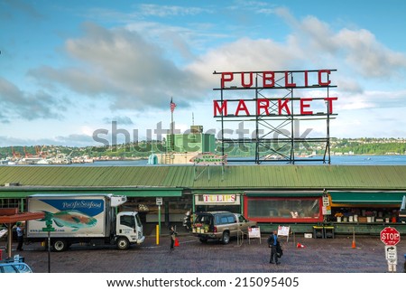 SEATTLE - MAY 9: Famous Pike Place market sign on May 9, 2014 in Seattle, WA. The Market opened in 1907, and is one of the oldest continuously operated public farmers\' markets in the US.