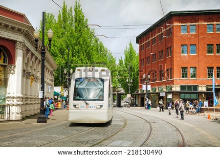 PORTLAND - MAY 4: Light train of the Portland Streetcar system on May 4, 2014 in Portland, Oregon. The Portland Streetcar system opened in 2001 and serves areas surrounding downtown Portland.