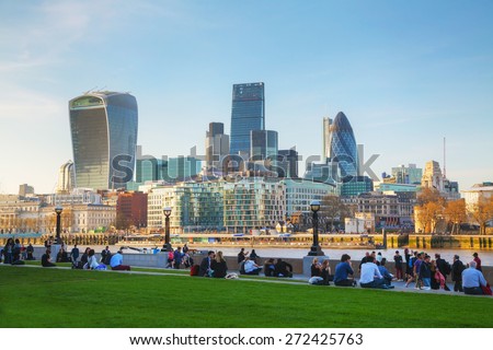 LONDON - APRIL 14: Financial district of the City of London on April 14, 2015 in London, UK. The City has a resident population of about 7,000 but over 300,000 people commute to and work there.