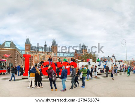 AMSTERDAM - APRIL 16: I Amsterdam slogan with crowd of tourists on April 16, 2015 in Amsterdam. Located at the back of the Rijksmuseum on Museumplein, the slogan quickly became a city icon.