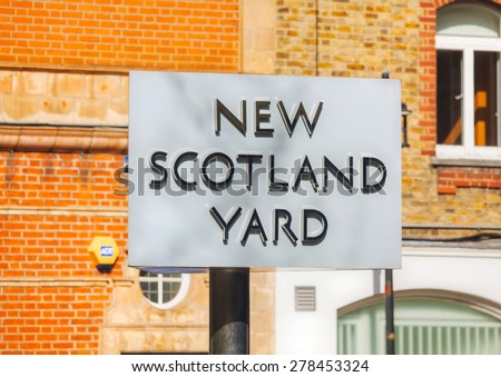 LONDON - APRIL 12: Famous New Scotland Yard sign on April 12, 2015 in London, UK. It\'s a metonym for the headquarters of the Metropolitan Police Service, the territorial police force of London.