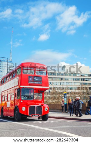 LONDON - APRIL 5: Iconic red double decker bus on April 5, 2015 in London, UK. The London Bus is one of London\'s principal icons, the archetypal red rear-entrance Routemaster recognised worldwide.