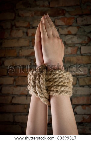Hands tied up with rope