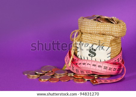 Sack full of coins over purple background