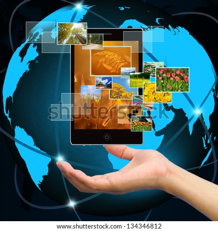 holding mobile smart phone with world technology background