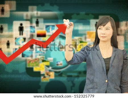 businesswoman hand writing rising arrow in the old paper