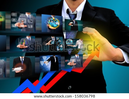Businessman drawing a rising arrow . business growth Concept