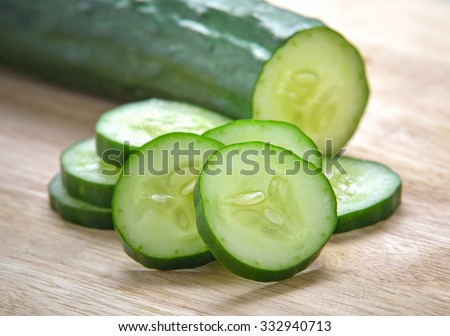 Fresh Cucumber  slices on wood background