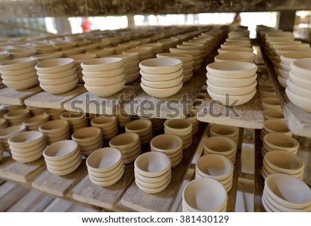 Ceramic cup in rack prepare for bring in furnace in factory