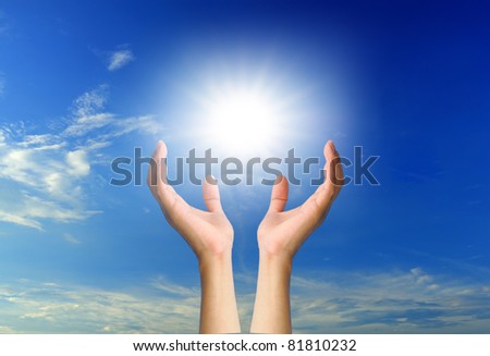 hand sun and blue sky with copyspace