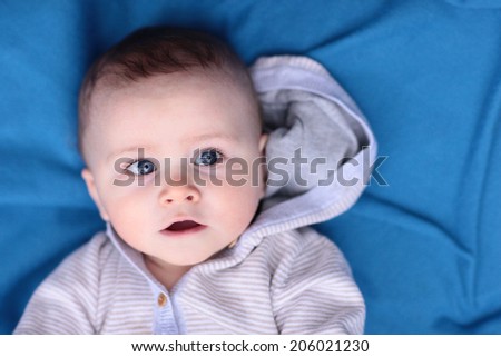 Blue Eyed Baby Boy on a Blue Blanket