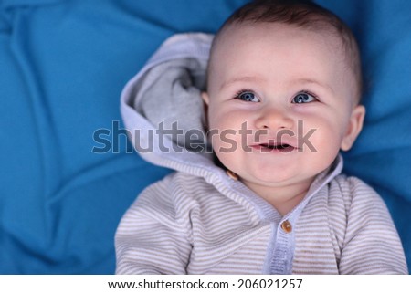 Blue Eyed Baby Boy on a Blue Blanket
