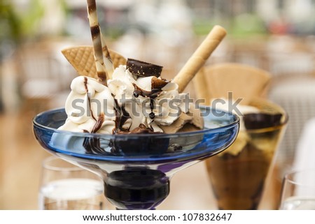 ice cream in a glass cup stands on the table