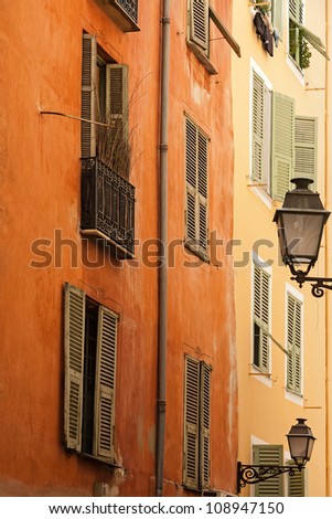 facade of the building in a narrow street of the old town in Nice, France