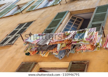 drying laundry outside the windows facing the street is a common sight in the Mediterranean countries