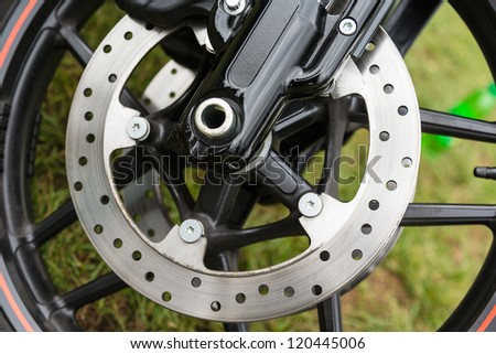Part of the braking system with a motorcycle front wheel