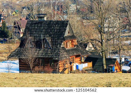ZAKOPANE - DECEMBER 31: Contemporary wooden house is a kind of typical family home usually with one or more guest rooms for tourists in Zakopane in Poland on December 31, 2012.