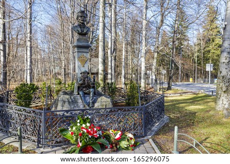 ZAKOPANE - NOVEMBER 17: Monument to famous Jan Krzeptowski Saba and Tytus Chalubinski, done in 1903 by Jan Malborczyk and designed by Stanislaw Witkiewicz in Zakopane in Poland on November 17, 2013