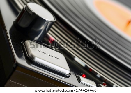 Turntable rotates, shown in close up from side of its control devices
