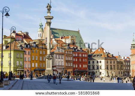 WARSAW, POLAND - MARCH 14, 2014: Statue of King Zygmunt III Waza and townhouses , Castle Square at the Old Town destroyed up to the basement during World War II, rebuilt in the years 1949-1958