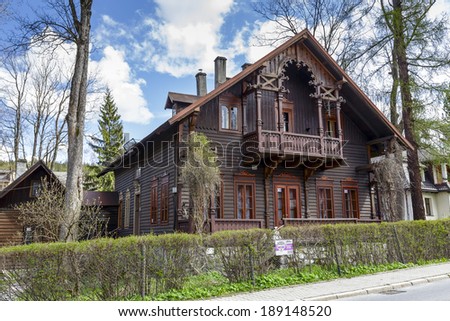 ZAKOPANE, POLAND - APRIL 20, 2014: Wooden Villa Grabowka III built in Tyrolean style in the 80\'s of the 19th century, with historic features listed in the municipal register of architectural heritage